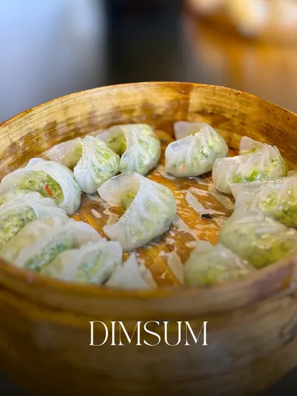Another variety of my steamed vegetable dim sum, showcasing the delicate pleats and fresh ingredients. I believe presentation is just as important as taste.