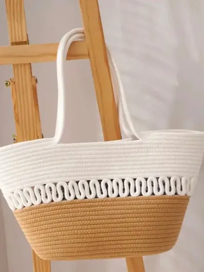 The jute rope basket hanging from a wooden stand, showing its potential as a stylish storage or even a decorative planter holder.