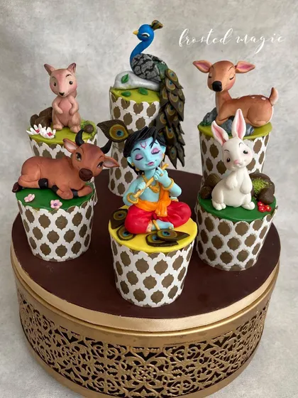 These little cuties won "Best In Show" at the India Bake Show! This set of decorated cupcakes tells the story of Krishna in the forest, surrounded by his animal friends. Each topper is a tiny, handmade sculpture.
