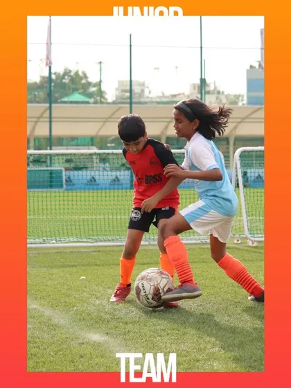 A girl and a boy from our junior teams competing for the ball. I am proud to foster an inclusive environment where everyone can play.