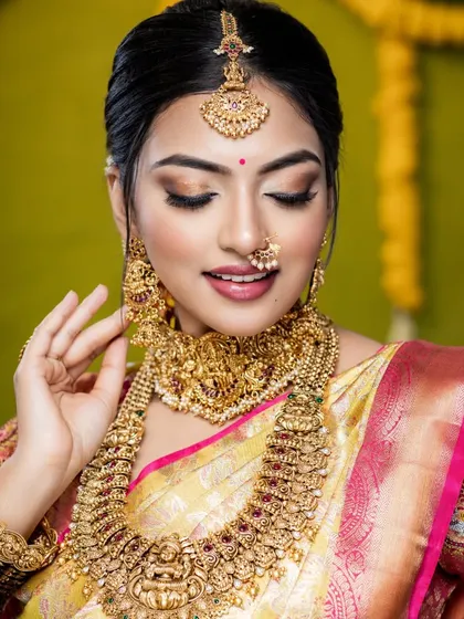 A detailed shot of the necklace and earrings. The craftsmanship in these temple jewellery pieces is what makes them stand out.