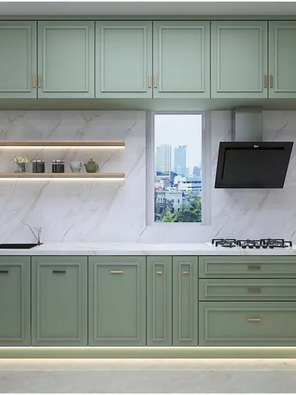 Another angle of the mint-green kitchen, showing the elegant cabinet detailing and the seamless integration of the chimney hood.