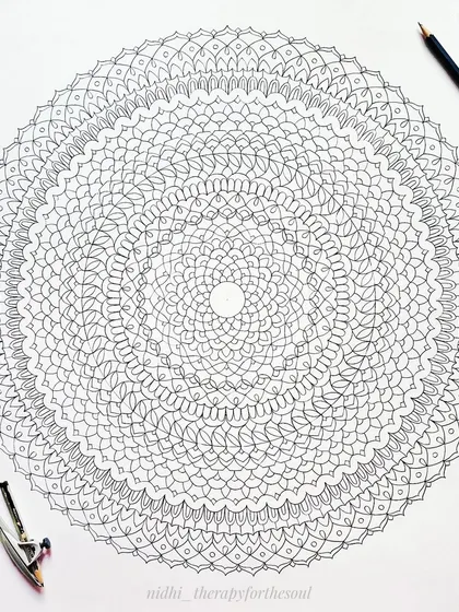 The complete line work for the large magenta mandala before any color was added. This is the foundational drawing, which takes hours of precise, geometric work.