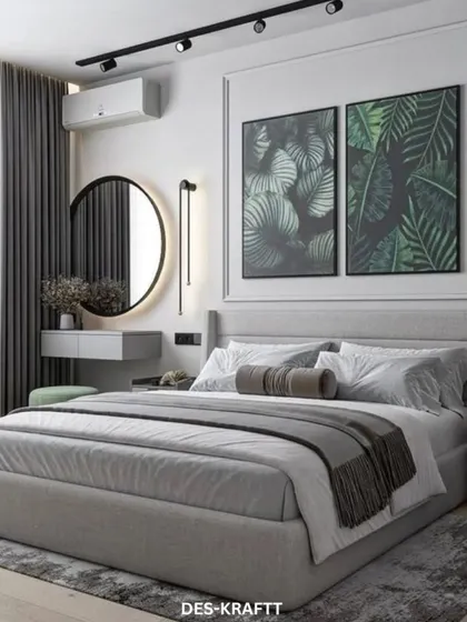 A full view of the grey-toned bedroom, where framed botanical prints above the bed and a plush area rug create a balanced and harmonious composition.