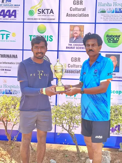 Another angle of Coach Raju receiving his ITF World Masters trophy. His success reinforces the quality of our elite batch coaching.