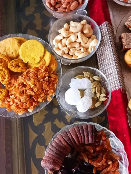 A display of the dry fruits, nuts, and savoury snacks that form an essential part of the 56 Bhog offering.