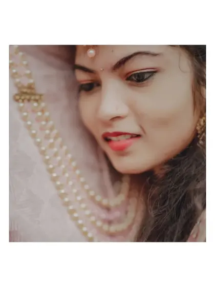 A close-up, artistic portrait of the bride from her engagement shoot, with a soft and dreamy feel.