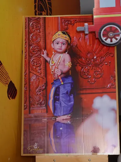I love creating personalized themes that tell your story. For this birthday party, we featured a large, beautifully printed portrait of the child dressed as Krishna, making it the centerpiece of the decor and a wonderful photo opportunity for guests.