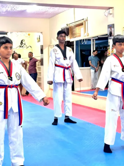 Three senior students demonstrating their form.