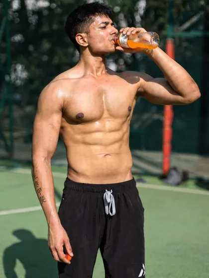 Fitness is about being able to play sports effortlessly and move without pain. Here I am rehydrating after a game, feeling strong and energetic.