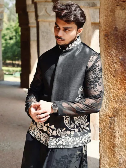 The combination of the sheer floral kurta and the embroidered paisley motifs on the jacket showcases our ability to blend different traditional elements into a cohesive, modern design.