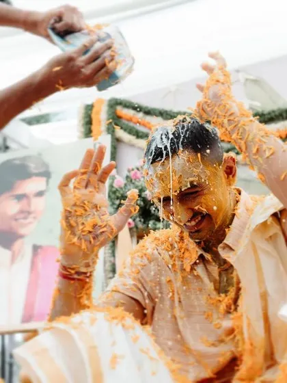 The groom enjoying a wild Haldi celebration with his friends. We capture the fun and camaraderie of these pre-wedding events.
