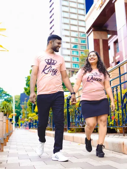 A candid moment of a couple walking and laughing together during their city pre-wedding shoot. I focus on capturing genuine interactions.