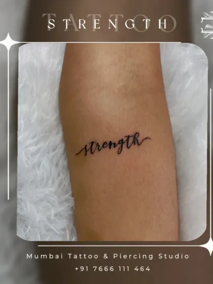 The word "strength" in a flowing script. This is a popular choice for a reminder of inner power, and we design it to feel both strong and graceful.