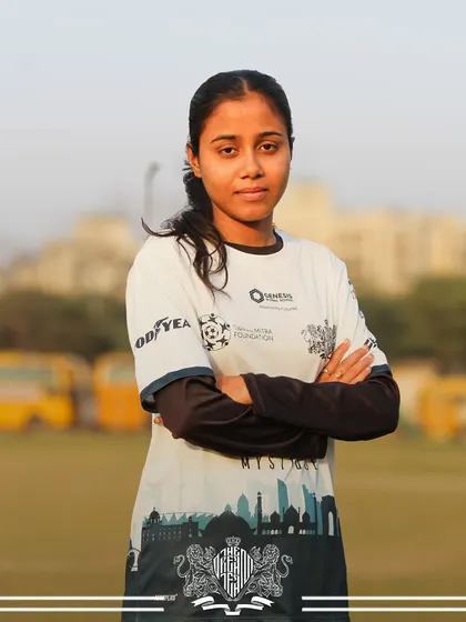 A portrait of a determined player, whose focus and intensity are palpable. She is a key part of our formidable squad.