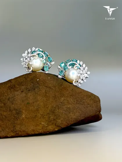 A pearl born of the ocean, emeralds shaped by the earth, and diamonds kissed by light. Together, they whisper a story only nature could write and you could carry.