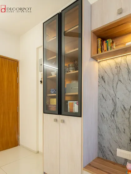 A close-up of the TV unit from image 120, showing the elegant glass-fronted display cabinet. It's perfect for showcasing crockery or decor items while keeping them dust-free.