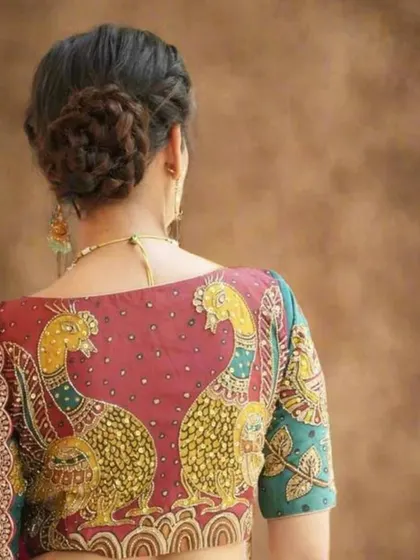 The back of this blouse is a work of art, featuring two beautifully hand-painted peacocks in the Kalamkari style.