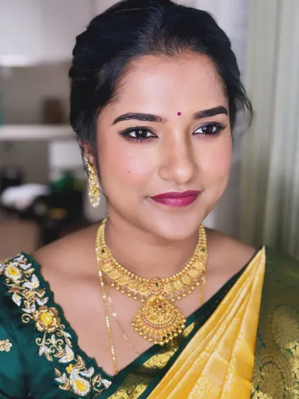 A minimalist makeup look for Keerthana. The focus is on clean skin and a simple yet defined eye, perfect for a traditional South Indian look.