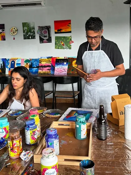 A puzzle painting workshop in progress at our studio. We provide complimentary pizza and drinks to keep the creative energy flowing.