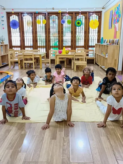 The cobra pose is a favorite among our little yogis! It helps strengthen their backs and opens up their chests, all while pretending to be little snakes.