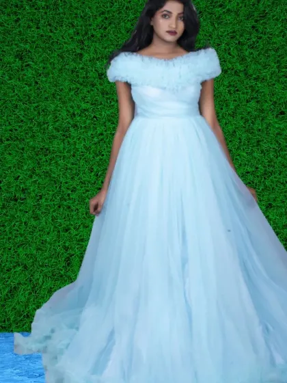 This light blue off-shoulder ball gown gives off major Cinderella vibes. The simple tulle design is timeless and perfect for a classic, elegant photoshoot.