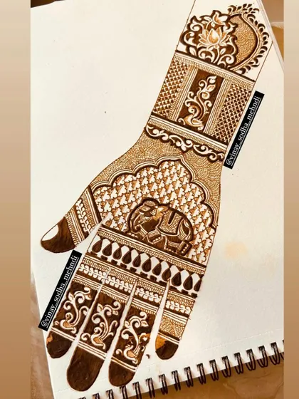 A traditional design featuring an elephant motif, drawn on paper. Practicing on paper is key to mastering symmetry and detail, especially for animal and bird figures.