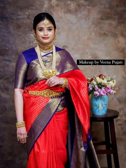 A direct portrait from the vintage shoot. The makeup is subtle yet defining, allowing the model's natural beauty and the rich saree to take center stage.