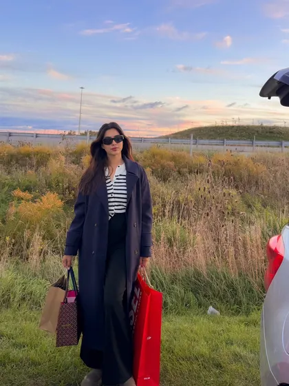 Posing by the car after a successful shopping day, showing off my classic fall look.
