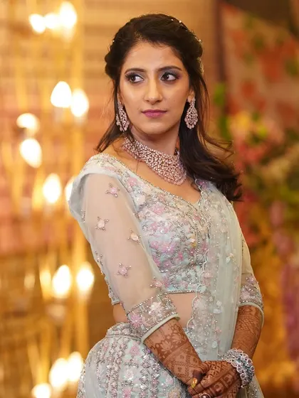 A beautiful look for a Sangeet ceremony. The makeup is designed to be long-lasting and vibrant, with soft glam eyes and a flawless base that ensures she looks stunning while she dances the night away.