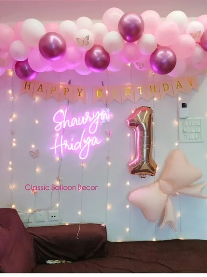 Another view of the personalized neon sign and balloon garland, showing how we can make any wall a feature wall.