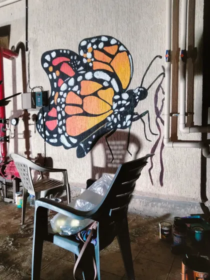 The worksite at night, with my paints and tools ready for a late-night session on the butterfly mural.