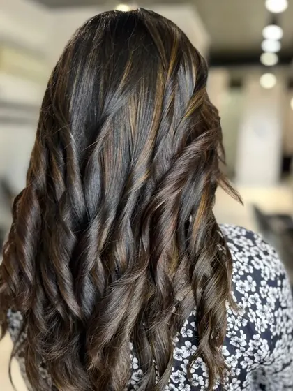 A back view of these beautiful curls, showing how they enhance the dimension of the highlights.