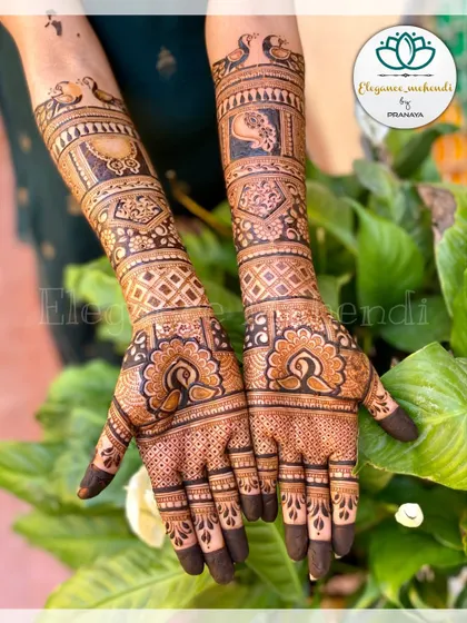 A classic full bridal mehendi with peacock motifs and intricate check patterns, perfect for a timeless wedding look.