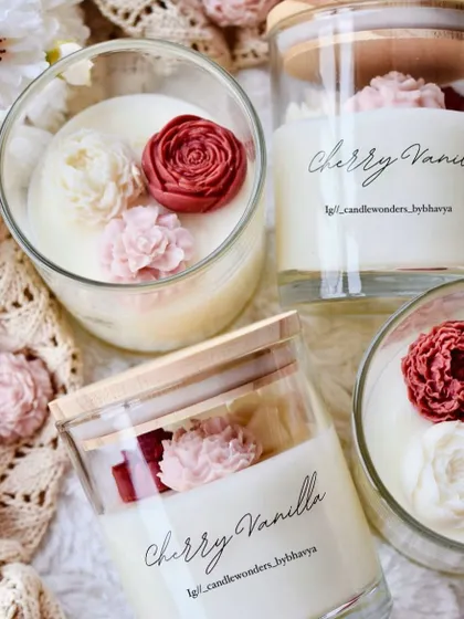 My Cherry Vanilla floral jar candles are a treat for the senses. The glass jar is filled with vanilla-scented wax and topped with beautiful cherry-colored wax flowers.