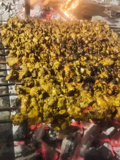 This is how we do it for big events. A huge grill full of chicken kebabs, cooked live over hot coals. The smell alone will make your guests hungry.