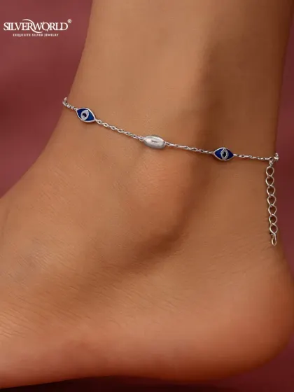 Protect your energy with our stylish Evil Eye anklet. This delicate 925 silver chain features classic blue enamel evil eye charms, designed to be a subtle yet powerful talisman against negativity.