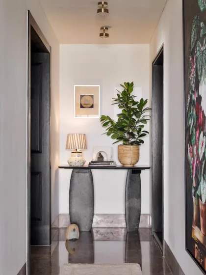 An identical shot of the corridor, a beautifully curated path through the home.