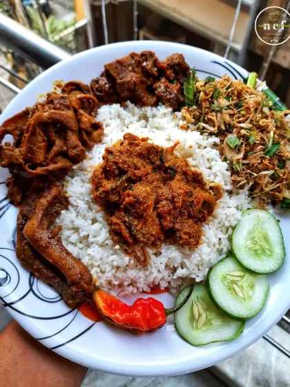 A heavy meal platter with buff curry, duck curry, and duck feet stir-fry. A true feast for meat lovers.