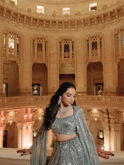 For Nikita's sangeet at Mehrangarh Fort, we went for something unexpected. This powder-blue fishtail lehenga by Gaurav Gupta was a modern, dramatic choice that stood out beautifully against the royal backdrop.