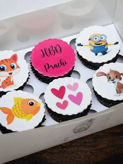 A sweet and simple birthday box perfect for any age. This set features cute, colourful cartoon characters like a minion, a cat, and a dog on edible toppers, making for a cheerful and fun gift.