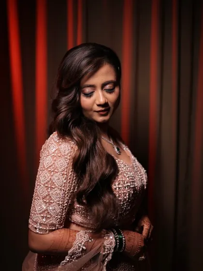 Another stunning shot of the reception look. The romantic curls and soft makeup create a look that is both elegant and modern.