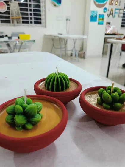 These succulent candles in terracotta pots are a popular choice and make for beautiful, long-lasting decor.