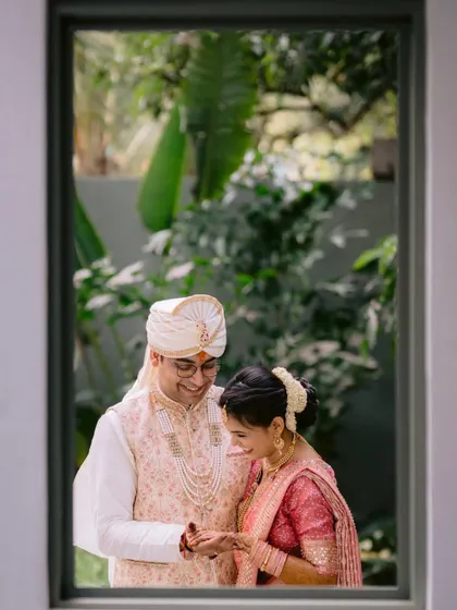 A candid photo of a couple framed by a window at our Backyard venue. It’s a perfect example of the creative and intimate shots possible in our space.