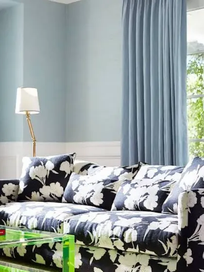A classic and timeless living room featuring light blue walls and crisp white wainscoting. This colour combination creates a fresh, elegant space that feels both formal and comfortable.