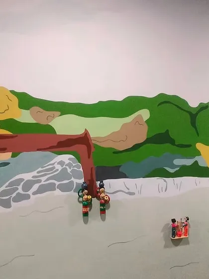 The finished section of the Anekal Gudi dolls mural, showcasing the unique blend of local folk art with a modern, corporate aesthetic.
