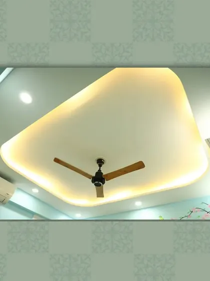 A simple yet beautiful ceiling design with a floating effect, created by the soft backlighting around its curved perimeter.
