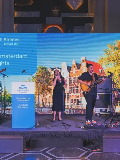 A shot of the full band on stage for a KLM Royal Dutch Airlines corporate event. This shows our professional setup for large-scale events, complete with custom branding. We ensure a polished, high-quality production every time.