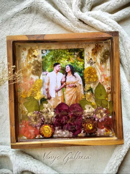 The full view of the special wedding gift frame, showcasing its rich colors and floral arrangement.