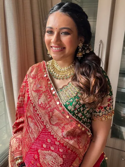 Another shot of the radiant mom to be. Her skin looks fresh and dewy, and the soft makeup enhances her natural beauty.